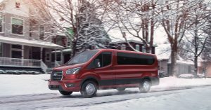 Red 2020 Ford Transit on snow road